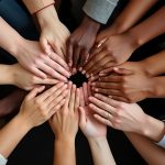 Hand from different ethnic groups in a circle